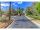 Elegant community entrance with lush landscaping and decorative brick pillars at 1604 Basildon Rd, Mount Pleasant, SC 29466