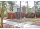 Back view of a complex with brick accents, balconies, mature trees, and maintained lawns at 1604 Basildon Rd, Mount Pleasant, SC 29466