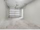 Spacious unfinished garage with concrete floor, equipped with an automatic door opener at 1604 Basildon Rd, Mount Pleasant, SC 29466