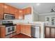 Cozy kitchen featuring wood cabinets, stainless steel appliances, and modern countertops at 1604 Basildon Rd, Mount Pleasant, SC 29466
