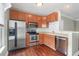 Spacious kitchen features wood cabinets, stainless steel appliances and hardwood flooring at 1604 Basildon Rd, Mount Pleasant, SC 29466