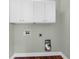 Laundry room featuring white cabinets, light gray paint and hardwood flooring at 1604 Basildon Rd, Mount Pleasant, SC 29466