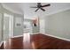Open-concept living room featuring hardwood floors and a partial view of the kitchen at 1604 Basildon Rd, Mount Pleasant, SC 29466