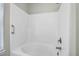 Clean, white tiled bathtub and shower combination with chrome fixtures in a well-lit bathroom at 1604 Basildon Rd, Mount Pleasant, SC 29466