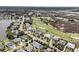 Aerial view showcases houses bordering a golf course, highlighting a tranquil and picturesque neighborhood at 1636 Rivertowne Country Club Dr, Mount Pleasant, SC 29466