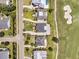 Aerial view showcasing neighborhood homes and a golf course with sand traps at 1636 Rivertowne Country Club Dr, Mount Pleasant, SC 29466