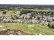 Wide aerial perspective of homes along a golf course, near a lake and wooded area at 1636 Rivertowne Country Club Dr, Mount Pleasant, SC 29466