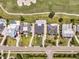 Aerial view highlighting homes and a golf course with multiple sand traps at 1636 Rivertowne Country Club Dr, Mount Pleasant, SC 29466