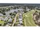 Stunning aerial view of homes along a lake and golf course offering a scenic and luxurious living environment at 1636 Rivertowne Country Club Dr, Mount Pleasant, SC 29466