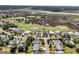 Gorgeous aerial view featuring homes bordering a beautiful golf course and marshland at 1636 Rivertowne Country Club Dr, Mount Pleasant, SC 29466