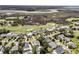 Breathtaking aerial view overlooking homes next to a golf course and expansive marsh at 1636 Rivertowne Country Club Dr, Mount Pleasant, SC 29466