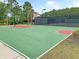Well-kept basketball court with vibrant lines, perfect for recreational games and practice, set near a tennis court at 1636 Rivertowne Country Club Dr, Mount Pleasant, SC 29466