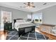 Bedroom features a queen bed, hardwood floors, ceiling fan and a scenic view overlooking the golf course at 1636 Rivertowne Country Club Dr, Mount Pleasant, SC 29466
