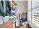 Walk-in closet features wood floors, custom organizers, and natural light at 1636 Rivertowne Country Club Dr, Mount Pleasant, SC 29466