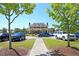 Elegant clubhouse with parking and well-manicured lawn offers a sophisticated venue for community gatherings and events at 1636 Rivertowne Country Club Dr, Mount Pleasant, SC 29466