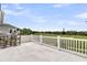 Spacious deck offers golf course views with chairs and white railings, perfect for relaxing outdoors at 1636 Rivertowne Country Club Dr, Mount Pleasant, SC 29466