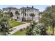 Charming two-story home featuring a lush front lawn, elegant columns, and inviting curb appeal at 1636 Rivertowne Country Club Dr, Mount Pleasant, SC 29466
