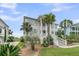 Charming coastal home with a welcoming entrance, manicured lawn, and lush landscaping for curb appeal at 1636 Rivertowne Country Club Dr, Mount Pleasant, SC 29466