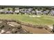 Scenic view of a well-manicured golf course, bordering beautiful homes and a natural marsh area at 1636 Rivertowne Country Club Dr, Mount Pleasant, SC 29466