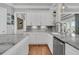 Gourmet kitchen features custom cabinets, stainless steel appliances, and open shelving at 1636 Rivertowne Country Club Dr, Mount Pleasant, SC 29466