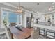 Open kitchen and dining area with views features stainless steel appliances and a center island at 1636 Rivertowne Country Club Dr, Mount Pleasant, SC 29466