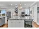 Bright kitchen features stainless steel appliances, a wine fridge, and marble countertops at 1636 Rivertowne Country Club Dr, Mount Pleasant, SC 29466