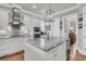 Well-lit kitchen features a center island, stainless steel appliances, and an open layout at 1636 Rivertowne Country Club Dr, Mount Pleasant, SC 29466