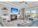 Inviting living room with fireplace, built-ins, plush seating, and scenic views at 1636 Rivertowne Country Club Dr, Mount Pleasant, SC 29466