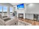 Comfortable living room with fireplace, TV, and access to the outdoor porch at 1636 Rivertowne Country Club Dr, Mount Pleasant, SC 29466