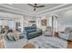 Open-concept living room with hardwood floors, comfortable seating, and access to other rooms at 1636 Rivertowne Country Club Dr, Mount Pleasant, SC 29466