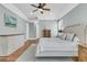 Elegant main bedroom with hardwood floors, decorative furniture, and a calming color scheme at 1636 Rivertowne Country Club Dr, Mount Pleasant, SC 29466