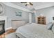 Comfortable main bedroom with fireplace, wood floors, and neutral wall paint at 1636 Rivertowne Country Club Dr, Mount Pleasant, SC 29466
