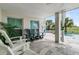 Outdoor patio with seating and a view of the pool and landscaping at 1636 Rivertowne Country Club Dr, Mount Pleasant, SC 29466