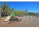 Community playground features slides and swings, surrounded by trees and landscaping in a Gathering-friendly environment at 1636 Rivertowne Country Club Dr, Mount Pleasant, SC 29466