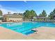 Sparkling community pool with clear blue water and comfortable lounge chairs, offering a refreshing escape for residents at 1636 Rivertowne Country Club Dr, Mount Pleasant, SC 29466