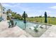 Beautiful pool featuring in-water lounge chairs, a sleek deck and a scenic golf course view at 1636 Rivertowne Country Club Dr, Mount Pleasant, SC 29466