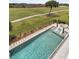 Inviting pool area featuring sun loungers, landscaping, and golf course views at 1636 Rivertowne Country Club Dr, Mount Pleasant, SC 29466