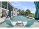 Stunning pool area with in-water seating and umbrellas, perfect for outdoor relaxation and entertainment at 1636 Rivertowne Country Club Dr, Mount Pleasant, SC 29466
