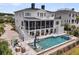 Luxury home featuring a private swimming pool, screened in porch and spacious backyard at 1636 Rivertowne Country Club Dr, Mount Pleasant, SC 29466
