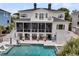 Beautiful home featuring a private swimming pool, cozy outdoor seating and spacious backyard at 1636 Rivertowne Country Club Dr, Mount Pleasant, SC 29466
