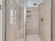 Shower features stylish tilework, a built-in niche, and a frameless glass enclosure at 1636 Rivertowne Country Club Dr, Mount Pleasant, SC 29466
