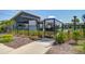 Community pool house with iron gate, palm trees, and adjacent swimming pool area at 1641 Adventure Xing, Mount Pleasant, SC 29466