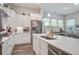 Modern kitchen featuring stainless steel appliances, white cabinets, and a kitchen island at 1641 Adventure Xing, Mount Pleasant, SC 29466