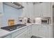 Modern kitchen with a gas stove, white cabinets, and stainless steel appliances at 1641 Adventure Xing, Mount Pleasant, SC 29466