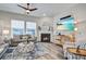 Comfortable living room featuring a fireplace, plush sofa, and bright natural light at 1641 Adventure Xing, Mount Pleasant, SC 29466