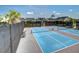 Community pickleball courts with blue surface, nets, black fencing, and surrounding residential homes at 1641 Adventure Xing, Mount Pleasant, SC 29466