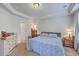 Bedroom featuring neutral carpet, crown molding, and two bedside tables at 1666 Bridwell Ln, Mount Pleasant, SC 29466
