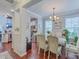 Bright dining area adjacent to the kitchen and hardwood flooring at 1666 Bridwell Ln, Mount Pleasant, SC 29466