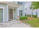 Inviting front entrance with decorative wreath, brick accents and a flower bed at 1666 Bridwell Ln, Mount Pleasant, SC 29466