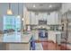 Modern kitchen features stainless steel appliances, granite countertops, and ample cabinet space at 1666 Bridwell Ln, Mount Pleasant, SC 29466